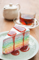 Rainbow crape cake on plate. (Selective Focus)
