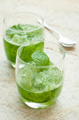 green smoothies on a brown background