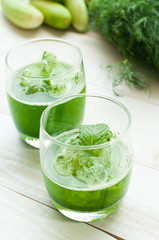 green smoothies on a brown background