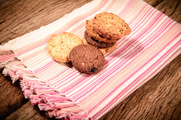 Fototapeta na wymiar Stacked cookies on colorful napkin