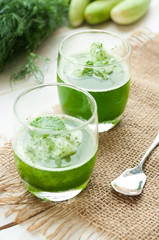 green smoothies on a brown background