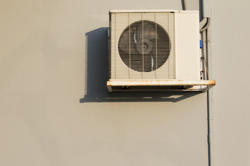 air condition heating coil handing on building wall with beautif