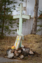 Old wooden orthodox cross in the yard of the monastery.
