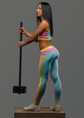 Female in colorful sportswear with hummer