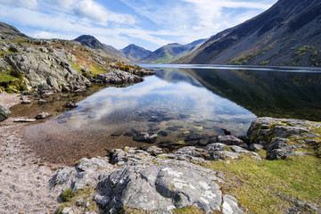 Stunning landscape of Wast Water with reflections in calm lake w