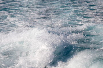 Foamy wake behind the stern of the ship