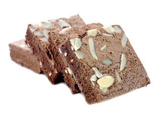 chocolate cake with almonds on white isolated background