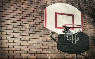 Basketball hoop on a brick wall