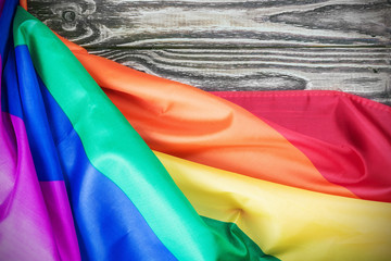 Rainbow gay flag on a wooden table