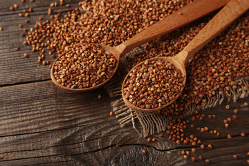 Buckwheat on brown wooden background
