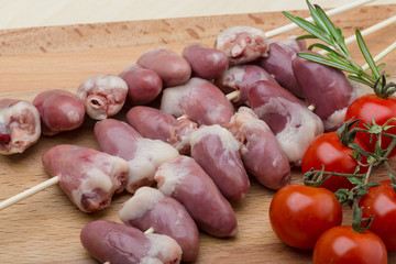 Raw chicken hearts for barbecue