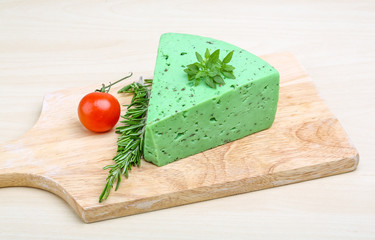 Green pesto cheese and basil leaves