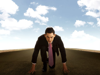 Young business man running on the street