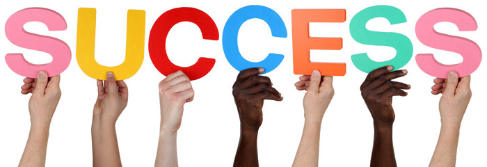 Multi ethnic group of people holding the word success
