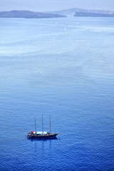 Boat sailing in the blue Aegean sea