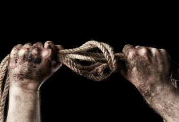 Male hand with rope. Conception aggression