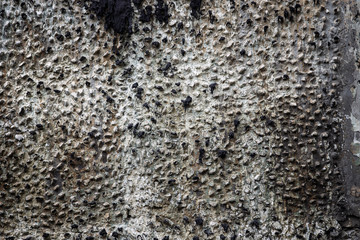 Abstract background of ruined burnt concrete wall with tar flows