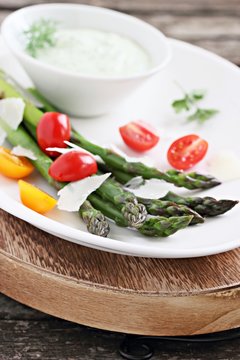 Green asparagus with tomatoes,parmesan and herbs dip.