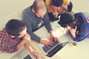 Young group of people discussing business plans.