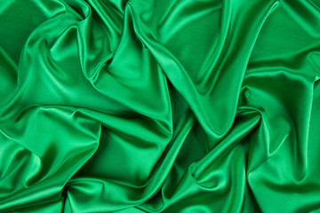 Fototapeta premium Green silk cloth with soft folds.