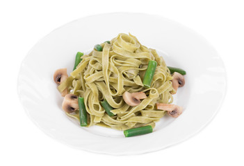 Pasta tagliatelle with green peas and ham.