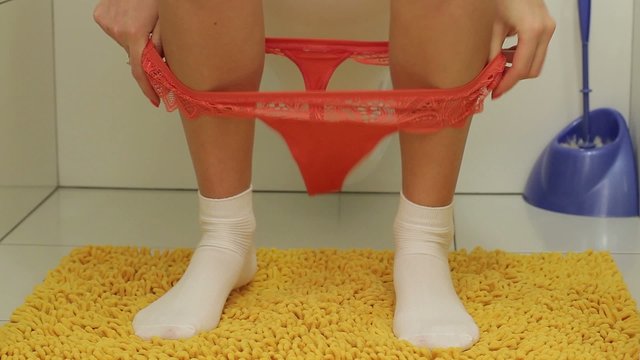 Girl in the toilet. Underwear lingerie.