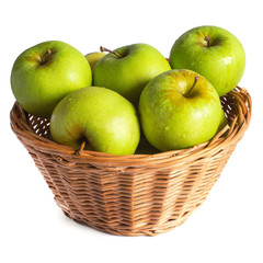 green apples in a wicker basket