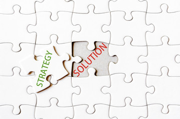 Missing jigsaw puzzle piece with word STRATEGY
