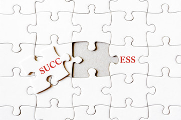 Fototapeta premium Missing jigsaw puzzle piece completing word SUCCESS
