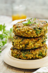 spicy vegan curry burgers with millet, chickpeas and herbs