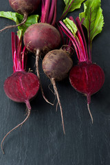 Bunch of whole beetroots farm fresh on dark background