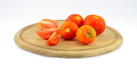 tomatoes on a cutting board wooden isolated on white background