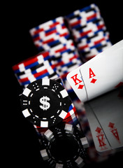 Obraz premium Poker chips and cards isolated on black background