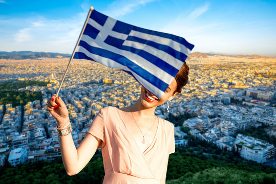 Woman With Greek Flag On Athens Cityscape Background