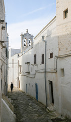 Fototapeta na wymiar Narrow alley in the center of the medieval town Ostuni in Puglia