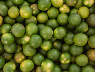 Fresh ripe limes on wooden table