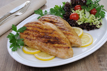 chicken grilled with a salad on a plate