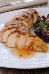Slices of chicken fillet with sauce