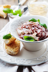 Octopus carpaccio in the table