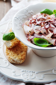 Octopus carpaccio in the table