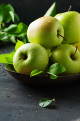 Green sweet apple on the table