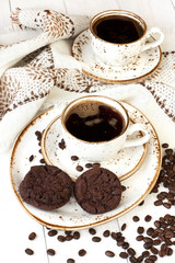 Chocolate cookies and cup of aromatic coffee 