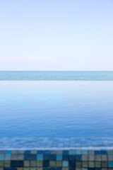 Luxury Infinity swimming pool with blue sky