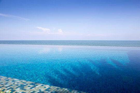 Luxury Infinity swimming pool with blue sky