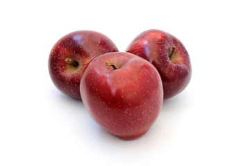 Fototapeta na wymiar Three ripe red shiny apple