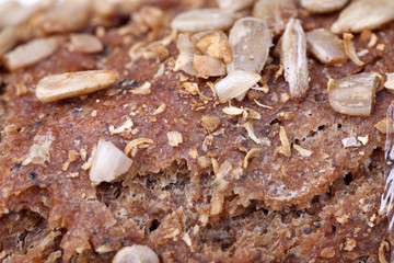 Bread with sunflower seeds texture close up