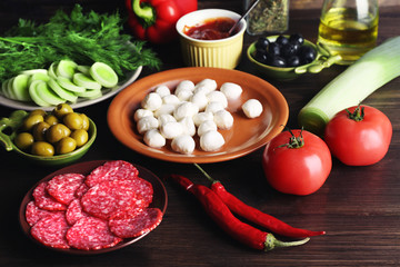 Different products on wooden table close up