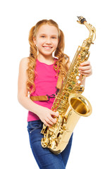 Obraz premium Close-up view of girl playing alto saxophone