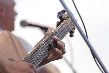 playing guitar on stage