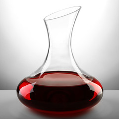 Glass carafe of wine on light background